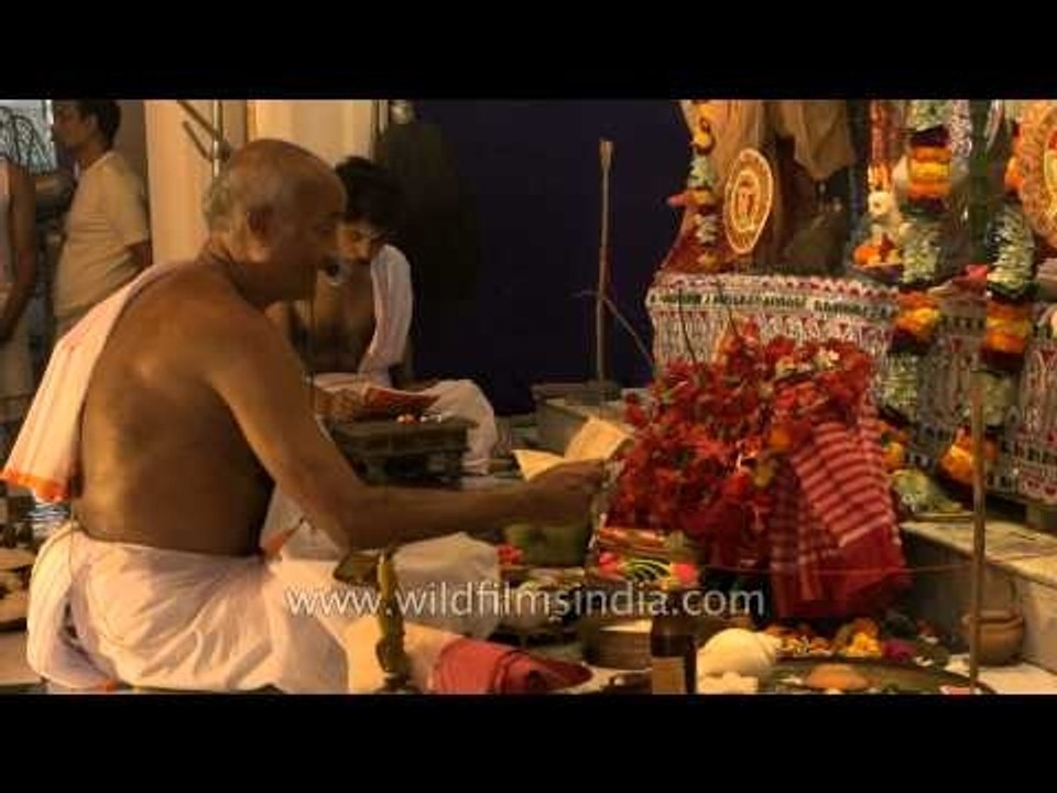 Priest chanting mantras to the Goddess