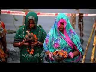 Devotees paying obeisance to the Sun on the occasion of Chhath Puja