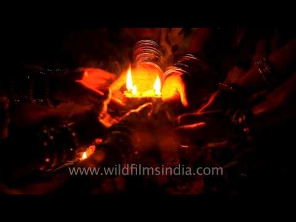 Devotees offer prayers to the sun during the Chhath festival on the banks of Yamuna
