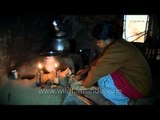 Tree house tribe : An Indian tribal woman cooking food