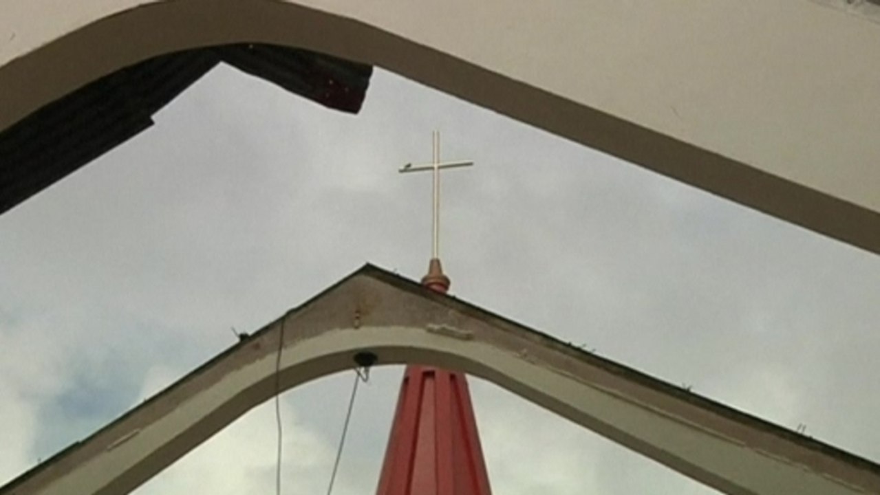 Morning mass in Typhoon devastation, as Aquino pledges action