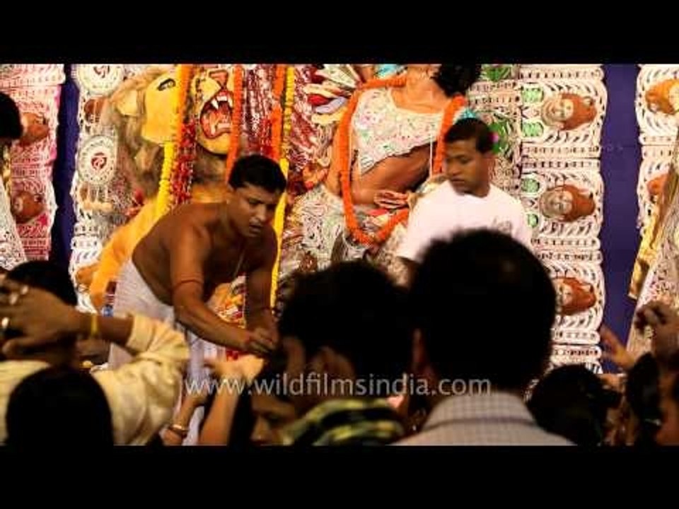 Blessings of Durga Maa being distributed at a Pandel in Kolkata
