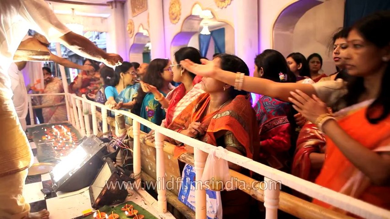 Distribution of blessings: Mesmerizing Puja pandal in Kolkata