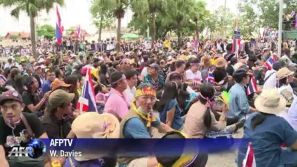 Crowds besiege a government building in Bangkok