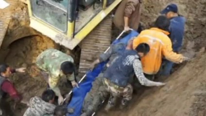 Man buried in sinking earth pit in China