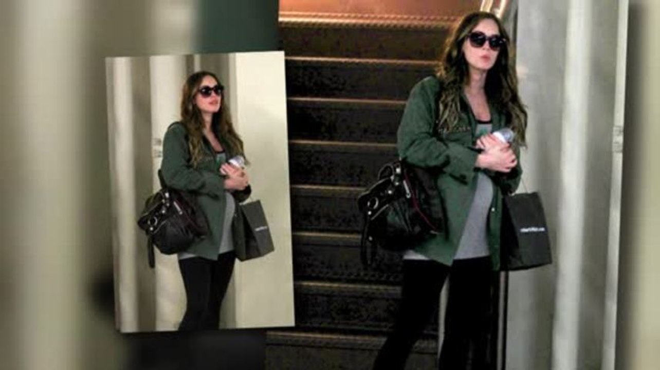 Megan Fox Covers Her Baby Bump on Family Outing