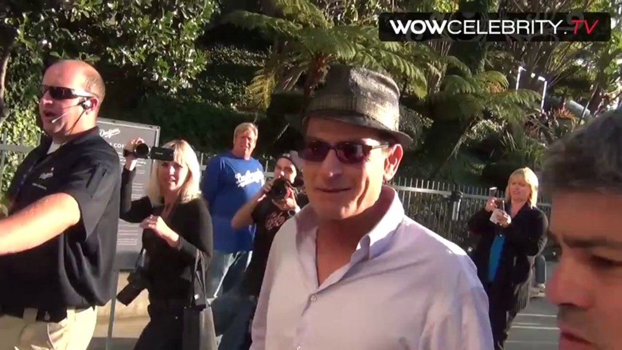 Charlie Sheen spotted arriving at the LA Dodgers gamesays he is a Cincinnati Reds fan