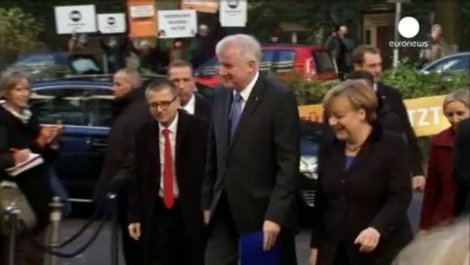 Chancellor Merkel does a deal with the SPD on forming a 'grand coalition'