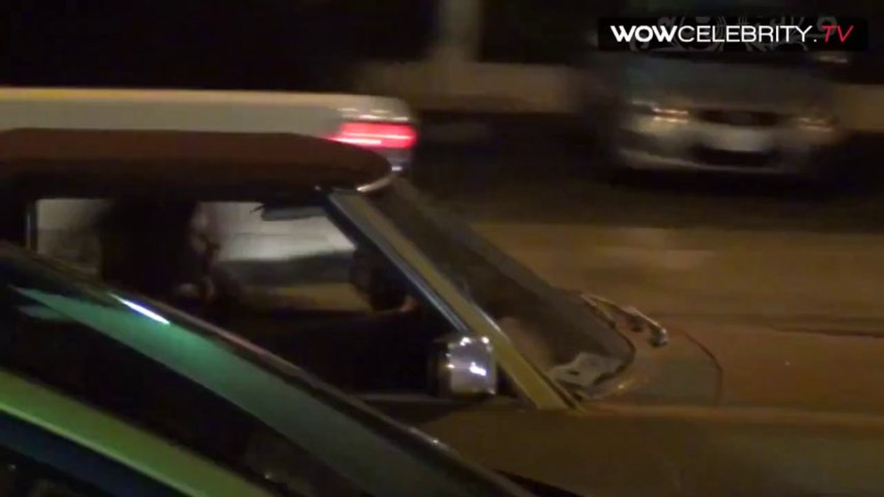 Lana Del Rey driving on Sunset in Hollywood
