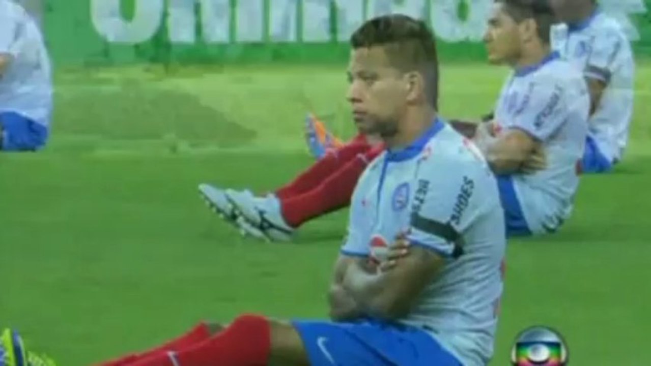 Sit-down football protest: Brazilian players sit on pitch