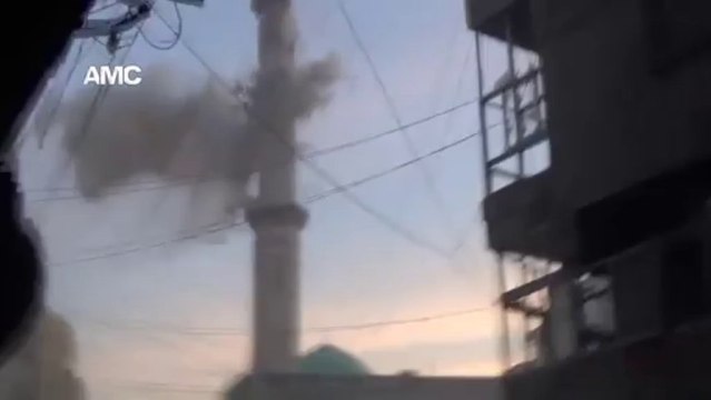 Fall of a Syrian Minaret after beeing shot by tank.