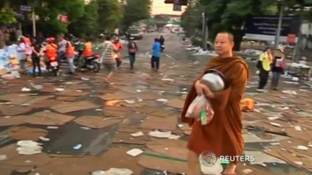 Debris and rubble litter Bangkok streets as dawn breaks in Thailand