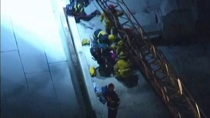 Woman trapped in gap between buildings in US
