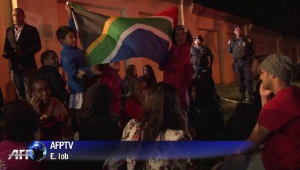 People mourn Mandela outside his Johannesburg home