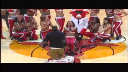 Man pops out of inflatable mascot costume to propose to Bull