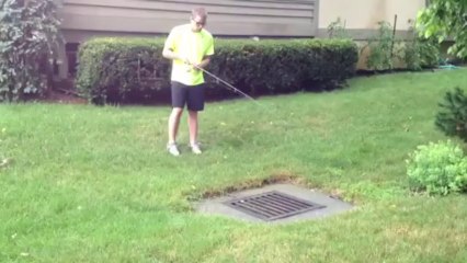 Fishing Bass into the Sewer beside his house !!?