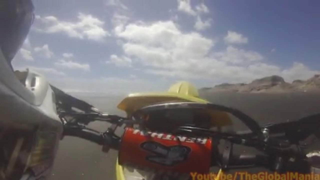 Powerful Dirtbikes Doing Wheelies Along The Beach