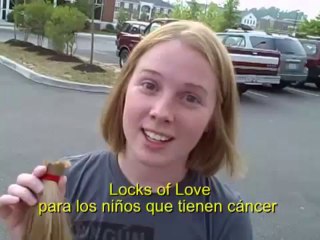 chopping of long blonde ponytail into a bob