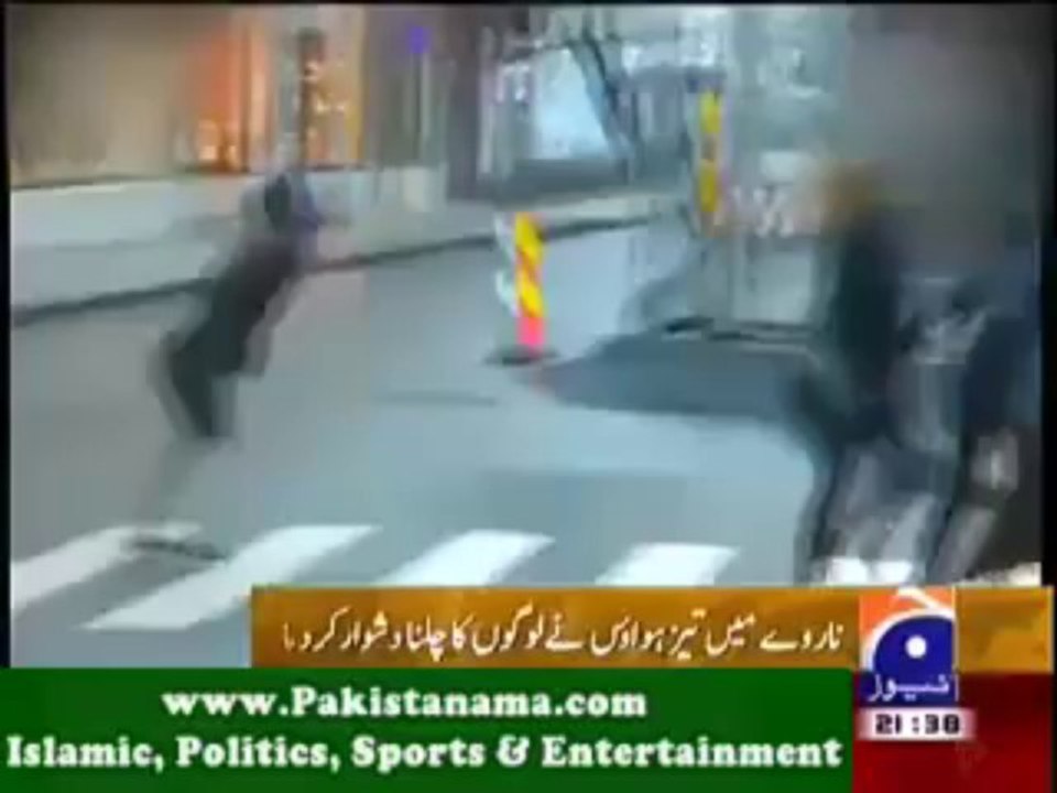 People Walking Against the Wind in Norway