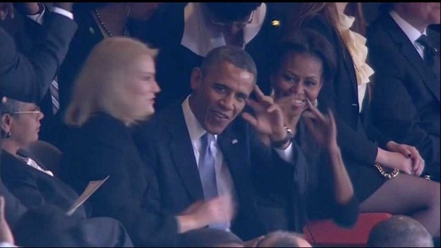 Obama garners big applause at Mandela memorial