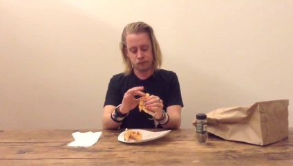 Macaulay Culkin Eating A Slice Of Pizza