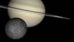 CU grey moon lower left orbits Saturn