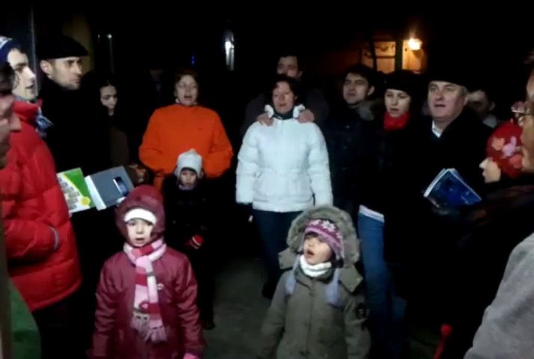 Caroling in the Christmas Eve