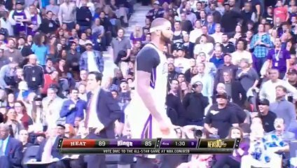 LeBron James balance DeMarcus Cousins au sol