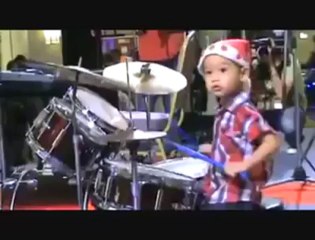 Small Kid playing drums
