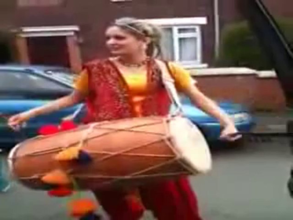 ---Pakistani Girl Playing with Dhol In UK.  must see and comments Please.flv