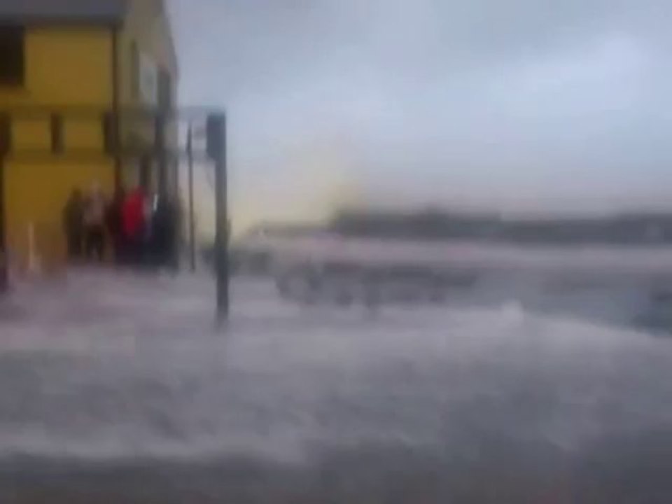 Waves Crash Over Seawall in Lahinch, County Clare