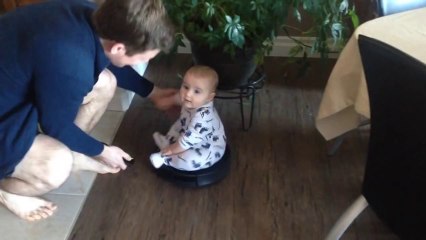 Baby Takes a Ride on a Roomba