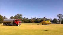 Firefighting Helicopters Land on Cricket Ground