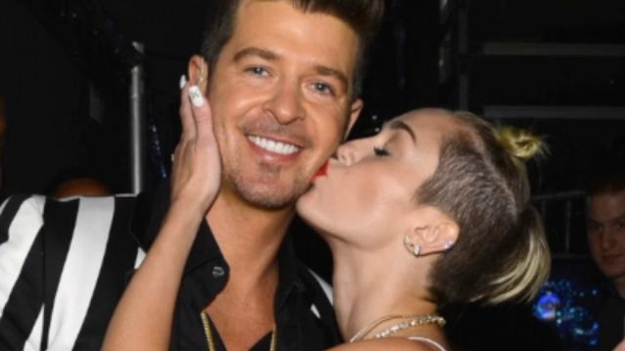 Miley Cyrus Says She's Not Responsible for Robi...