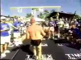 Father runs triathlon with his son in tow