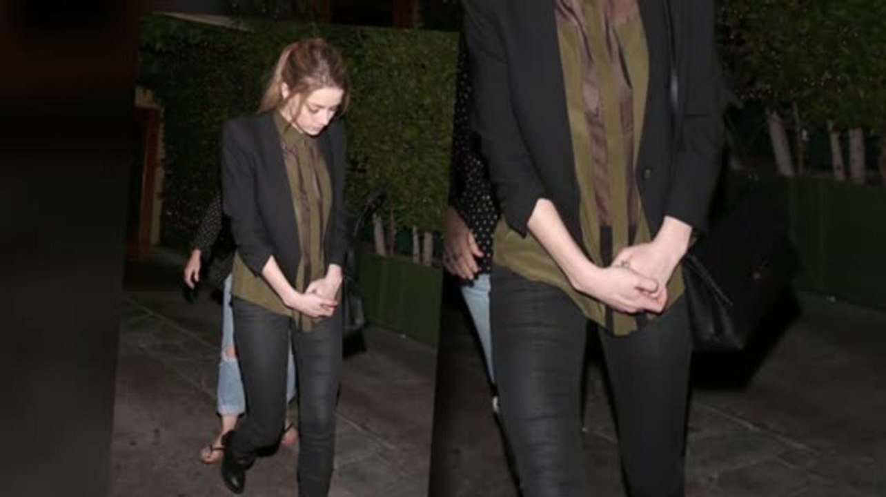 Amber Heard Suspiciously Covers Ring Finger