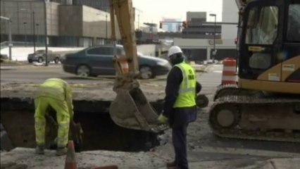 Sinkhole collapses street in Detroit