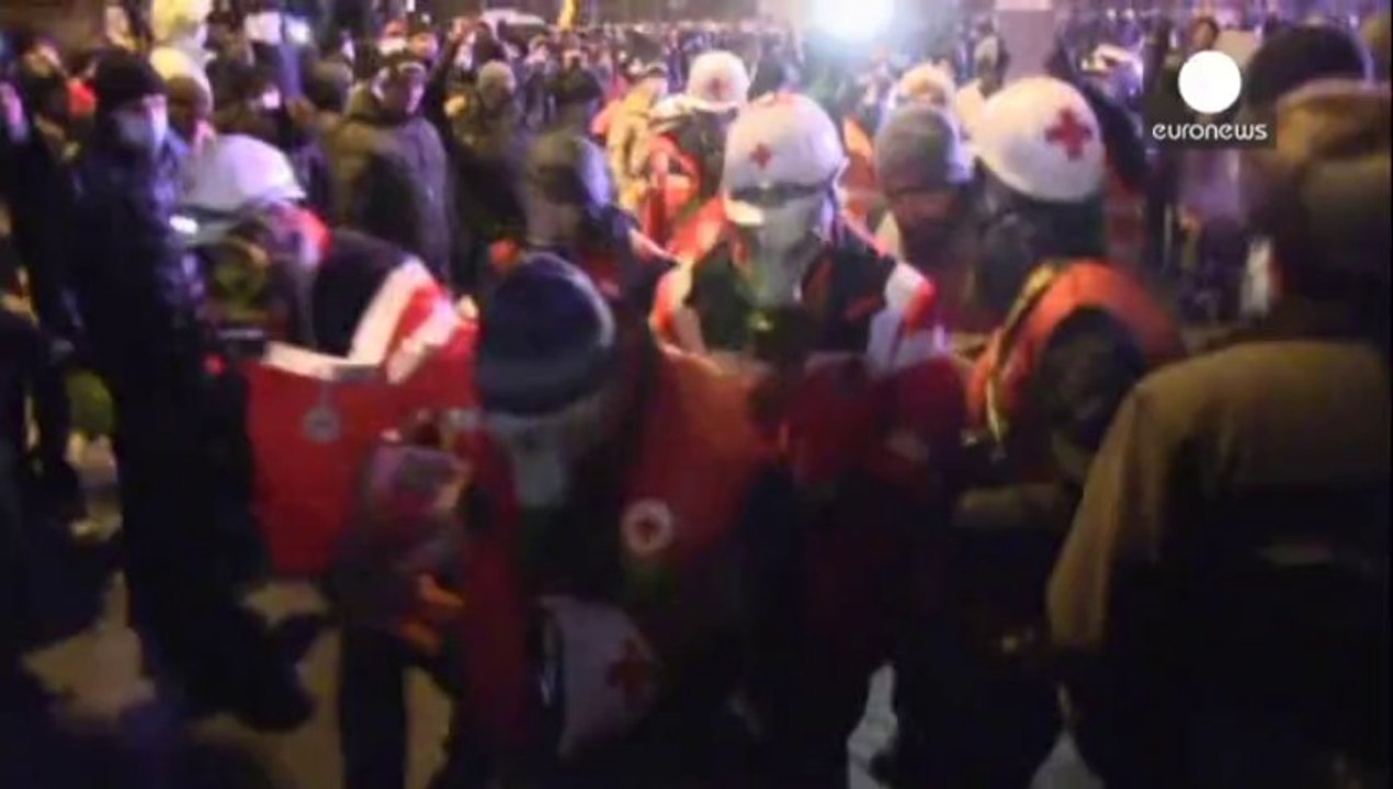 Dozens injured in Kyiv after clashes with riot police