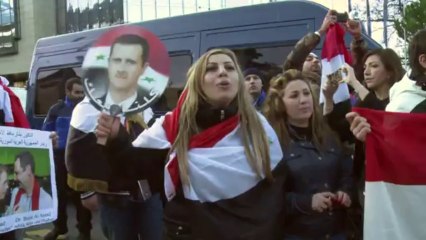 Pro-regime protesters rally outside Syria talks