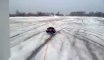 A car pulls a guy lay on the snow! Crazy dumb guy!