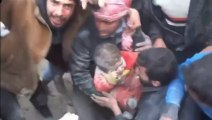 Buried baby is pulled from underneath rubble in Aleppo