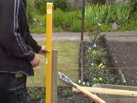 How to concrete fence posts for a garden path