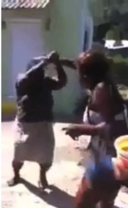 Jamaican Granny Beats Young Girl With Stick!
