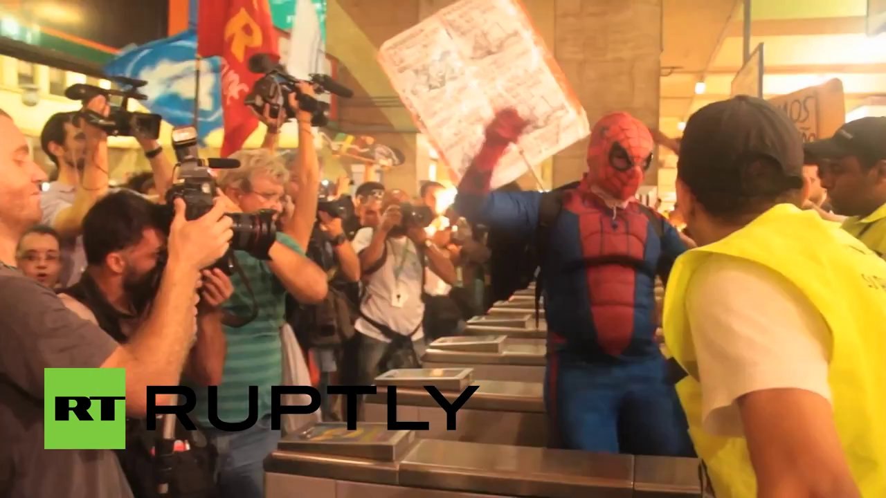 'FIFA, pay my fare!': Brazilians protest transport hikes in Rio de Janeiro