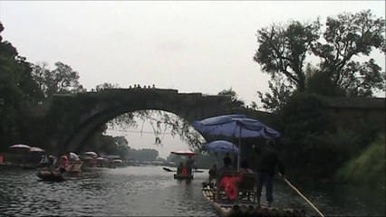 Exhilarating Bamboo Raft Ride with a Serenade.   Enchanting Beauty of Yu Long He.   Yang Shuo, China Tours
