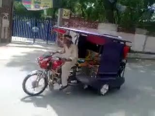 bike riksha wheeling and throwing passengers