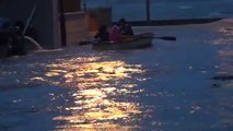 Boating Down the Street in Flooded Village