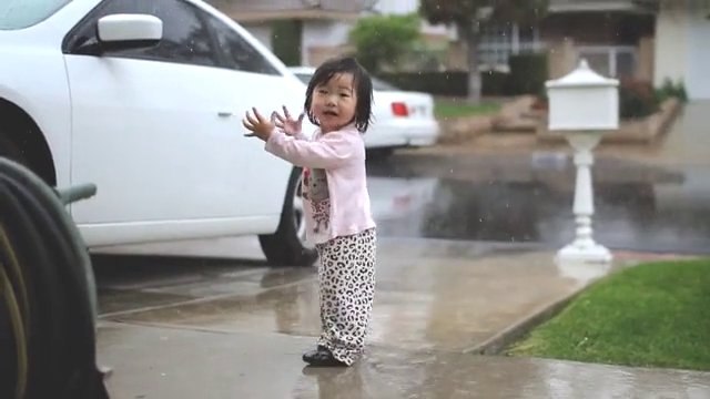 Toddler Playing In The Rain For First Time Is The Epitome Of Pure Joy