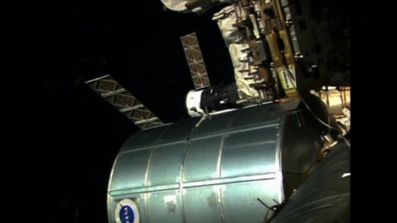 Russian spacecraft docks with International Spa...