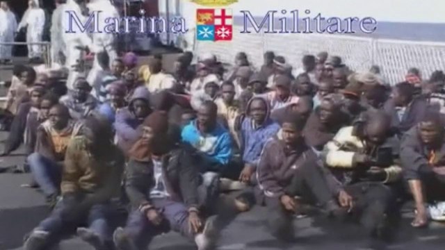 Migrants crammed into rafts rescued by Italian navy